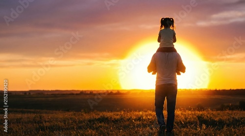 Father and Daughter Enjoying Sunset Together in Open Field with Warm Light