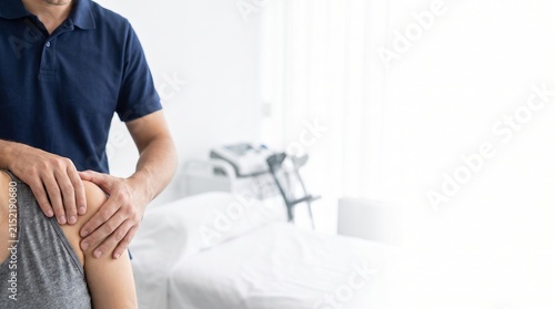 Therapist Assisting Patient with Shoulder Rehabilitation in Modern Clinic Setting