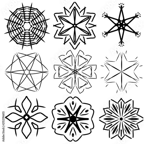 Collection of hand-drawn black and white decorative floral and geometric motifs with symmetrical shapes and ornamental details.