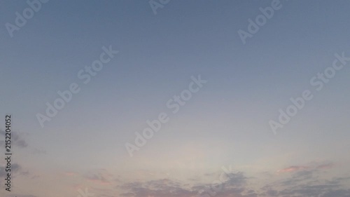 Abstract minimalist sky background. Clean and clear gradient colors of a blue and pink twilight sky. Calm atmospheric view of a serene dawn or dusk.