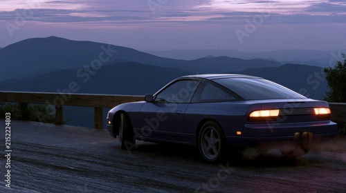 Blue sporty vehicle driving along a mountain road at twilight with a picturesque landscape of hills and the evening sky