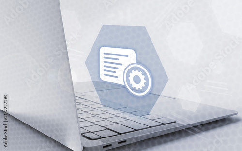 Digital settings icon hovering above a laptop keyboard, representing system configuration, software optimization, user preferences, technical customization, and advanced computing processes.
