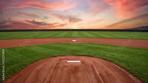 Beautifully maintained softball field on sunset scenery, featuring clean bases, smooth pitching mound, and lush infield grass, 4K video