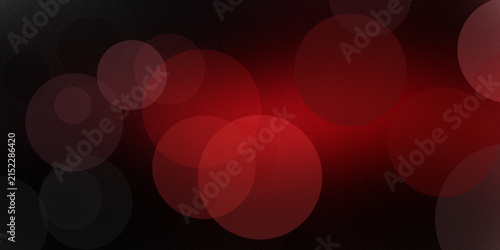 Red circles on dark background abstract design with bokeh effect and noise texture.
