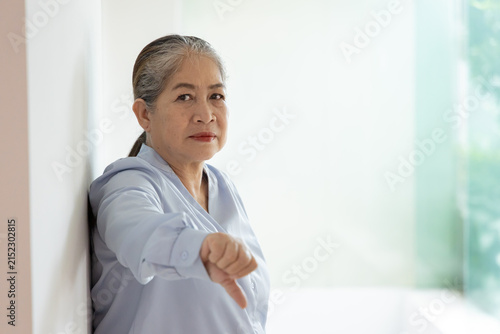 Bild auf Leinwand Unhappy and upset old woman with white or silver hair showing rejecting, disappr