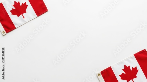 Two Canadian flags on white background with copy space in middle