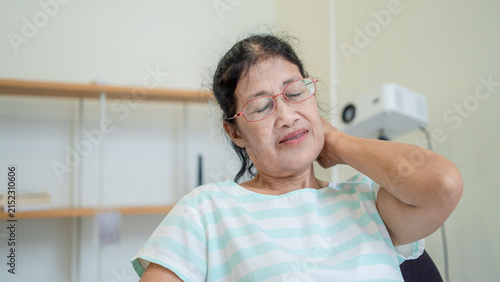 Canvastavla Asian senior woman use hand squeeze nape to relieves symptoms cramps, pain muscle, osteoporosis