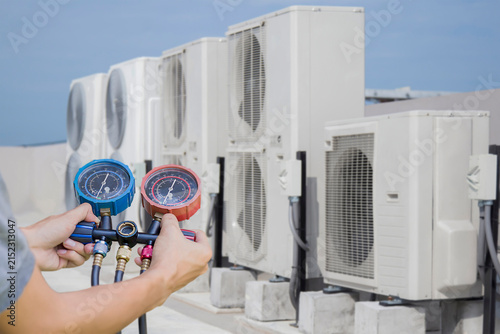 air conditioning and ventilation systems are installed on the roof of an industrial building.