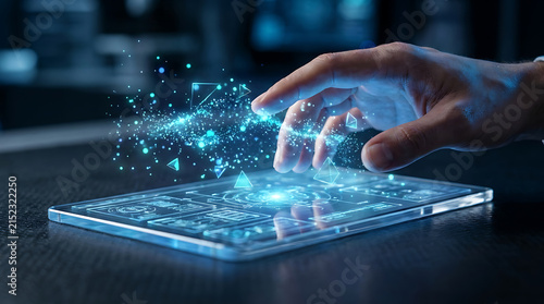 Futuristic Interface Interaction: A human hand reaches out to a digital tablet, interacting with a glowing, abstract network of blue light particles, symbolizing advanced technology and connectivity.