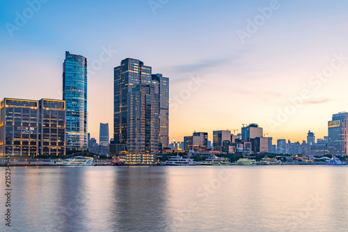 Modern urban architecture, road traffic, and Huangpu River night view in Lujiazui, Pudong, Shanghai, China