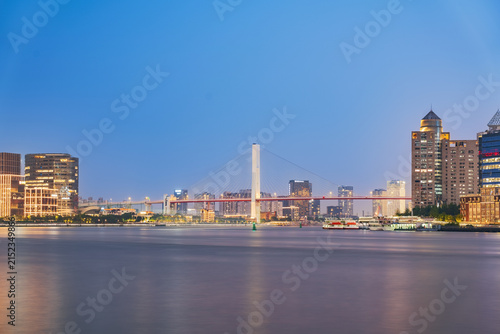 The skyline of modern urban architecture in Shanghai, China, and the scenery of Yangpu Bridge and Huangpu River