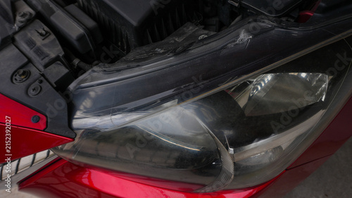 Close Up of Red Car Body and Chrome Front Grille Detail