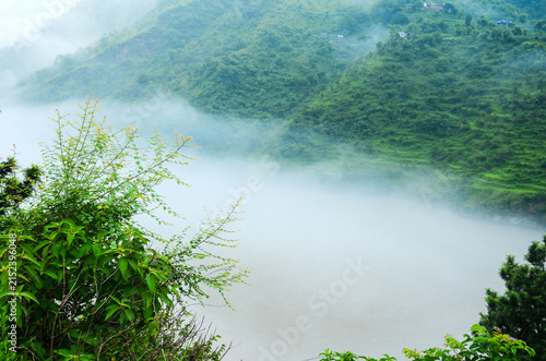 Misty Green Hills with Foggy Valley Landscape