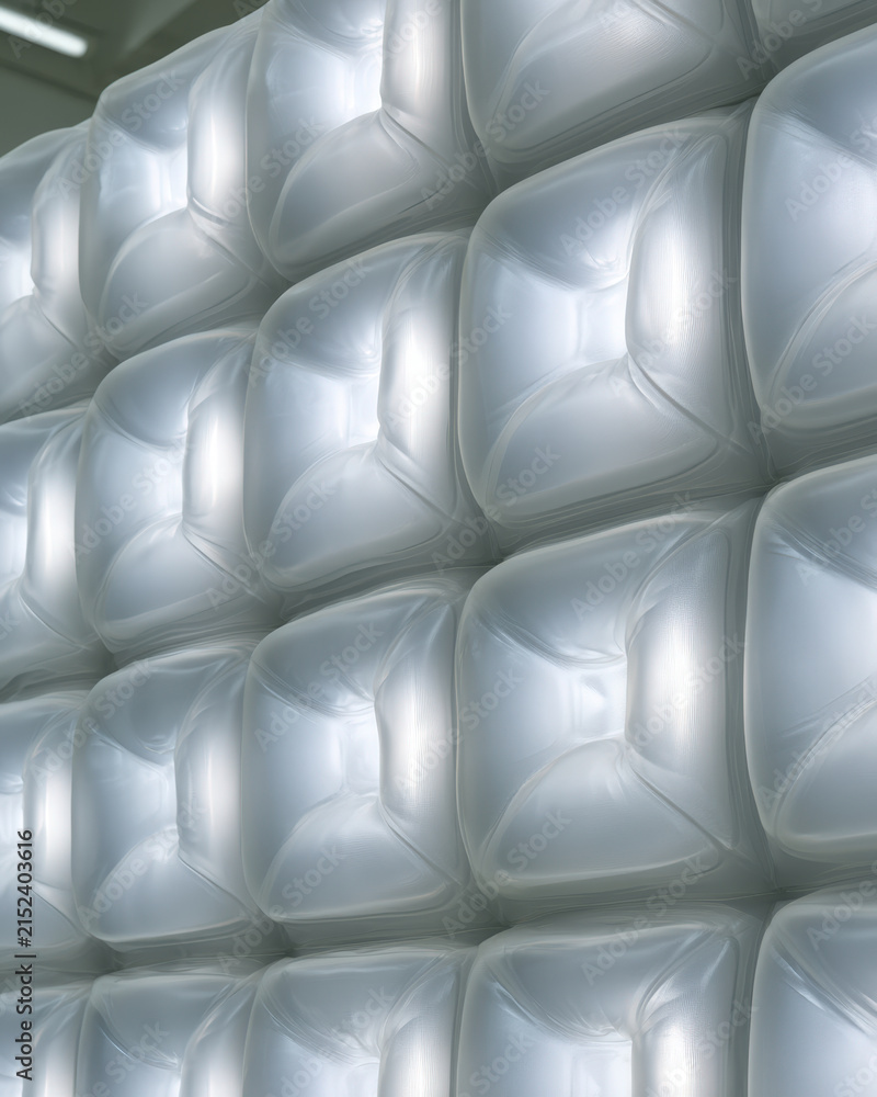 Obraz premium Silver Quilted Padded Wall Texture with Reflective Soft Cells and Copy Space