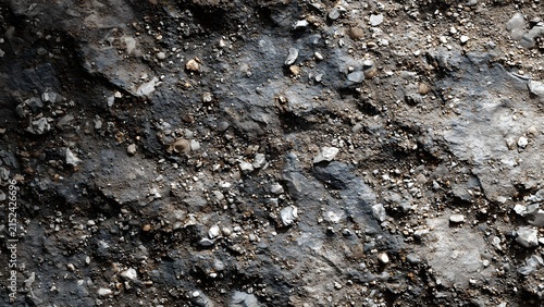 Detailed asphalt texture featuring scattered rocks, gravel particles, and natural rough pavement surface patterns,