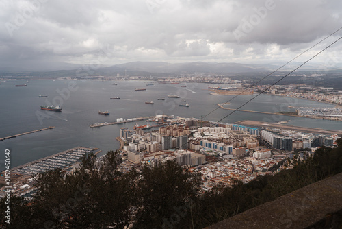 Panoramic high angle view of the Bay of Gibraltar, harbor, and cityscape from the Rock of Gibraltar