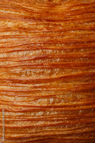 Bild auf Leinwand Extreme macro texture of glossy golden laminated pastry crust with crisp flaky l