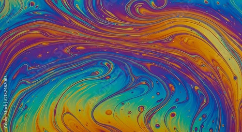 Abstract colorful swirls of oil and water creating iridescent patterns