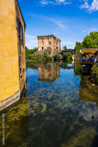 Visconti Bridge of Valeggio sul Mincio, combining the functions of bridge, rampart and dam to control the waters of the Mincio river at Borghetto