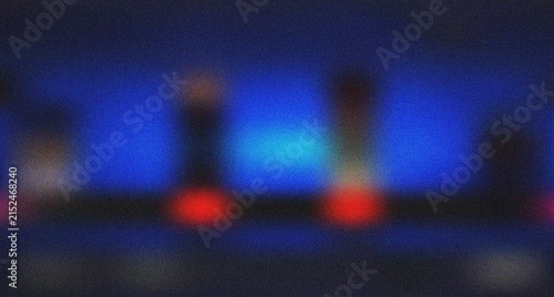 Quadro su tela Vibrant blue and red abstract light composition on a dark grainy surface evoking