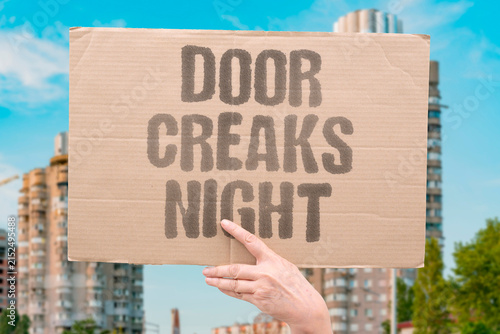 Fotografie "Door creaks night" A subtle sound from the door makes the whole house feel aware of you