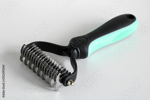 Cat Dematting Comb for Removing Mats and Tangles from Fur on White Background