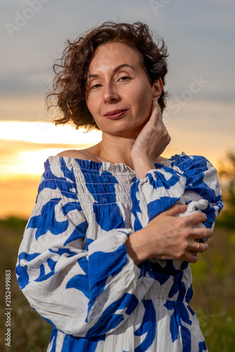 Woman in Blue Off-Shoulder Dress at Sunset