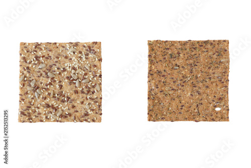 Quadro su tela two square variety crispbread crackers with seeds and herbs, isolated on transpa