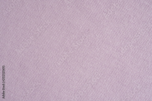 Closeup of pale mauve cotton jersey fabric background with stitches texture