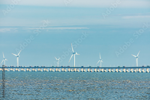 Photography Sea bridge with offshore wind turbines near Shanghai city, China