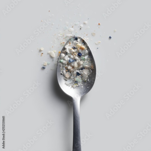 spoon filled with microplastics food contamination pollution concept