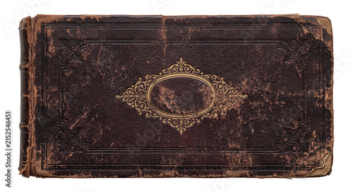 Antique leather bound book cover with ornate gold detailing and worn edges