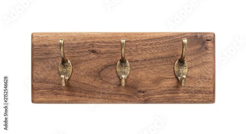 фотографія Rustic wooden coat rack with three antique brass hooks for entryway organization