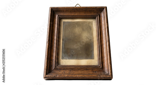 Canvas Print Antique wooden picture frame holding a faded vintage photograph