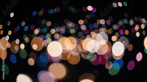 Colorful Abstract Bokeh Lights Glowing Against Dark Night Background