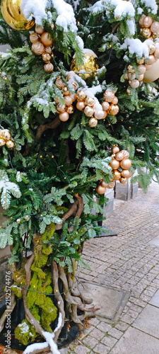 Decorative Christmas tree with ornaments and snow in a winter setting