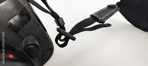 Camera strap parts showing the attachment method