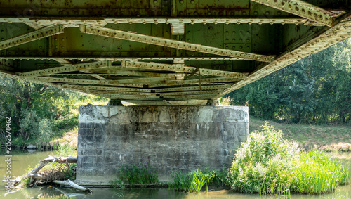 Bild auf Leinwand View of the railway bridge over the river from below