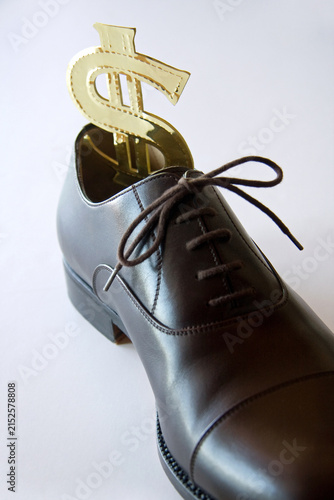 Konstfotografi Small business standing in bigger shoes
