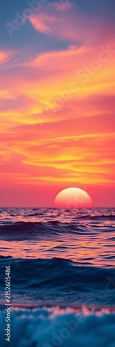 Soft pink and orange hues blend in a serene sunset over calm ocean waves, peaceful, orange