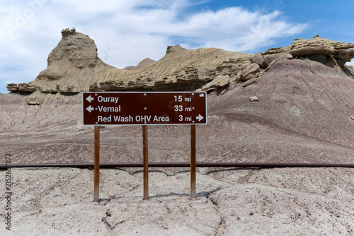 Ouray/Vernal sign with formations in the background