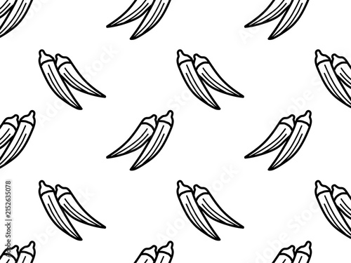 Okra background with scattered vegetables, black