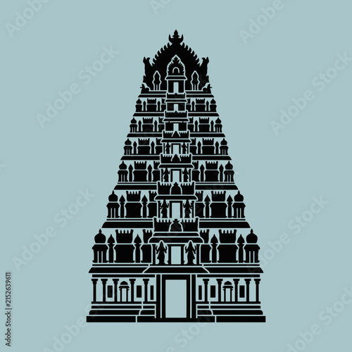 A black silhouette of an ornate traditional temple tower on a light blue background