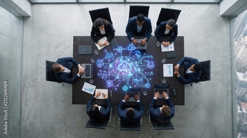 Diverse business team collaborates on AI and cloud technology strategy in modern boardroom