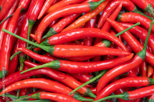 pile of fresh red Jinda chilies for background. top view