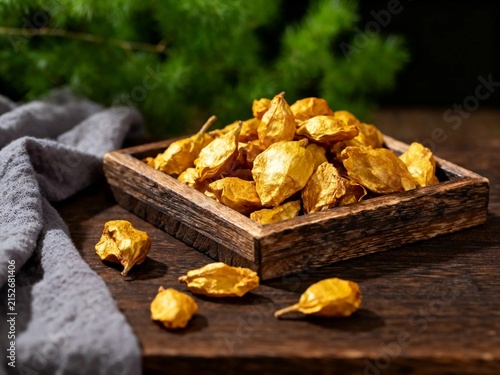 Golden Dried Cloves in Rustic Wooden Tray
