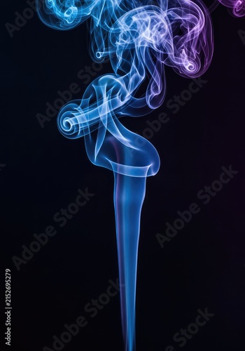 Vibrant abstract blue and purple colored smoke flowing and twisting mysteriously against a deep black backdrop, creating ethereal texture, mysterious, pattern, flow
