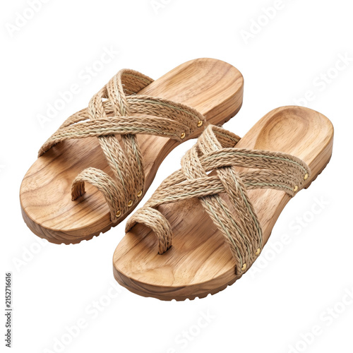 Woven straw sandals isolated on white. Summer beach footwear with comfortable flat soles.