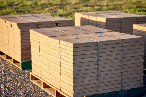 Stacks of Patio Blocks on a Wooden Pallet sitting on top of Gravel