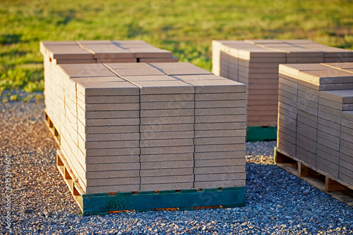 Stacks of Patio Blocks on a Wooden Pallet sitting on top of Gravel